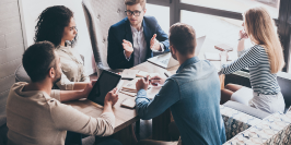 Marketing experts sitting around a table