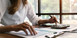 business woman using a calculator